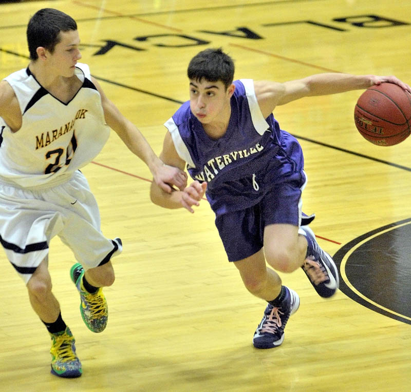 Maranacook sophomore guard Kodey Solmitz, left, covers Waterville senior guard Jordan DeRosby during a game Friday at Maranacook Community School in Readfield.