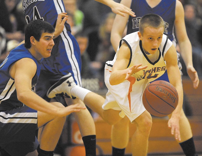 Skowhegan Area High School's Eli Holland, 10, right, breaks free from Erskine Academy defender Caleb Rivera, 32, left, in the second quarter at Skowhegan Area High School on Friday.