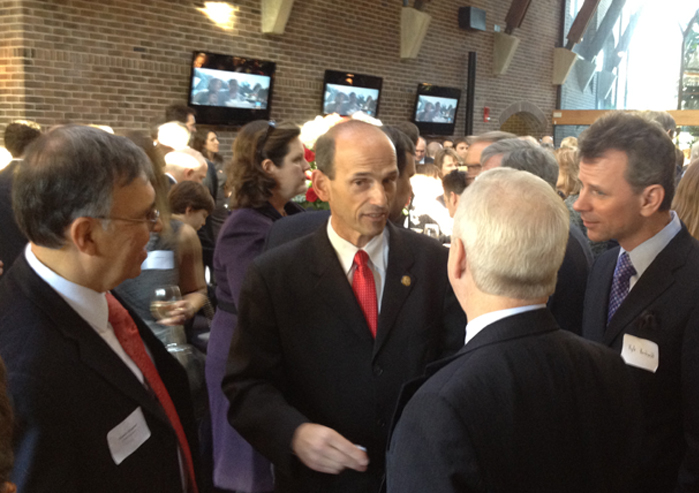 Former Maine Gov. John Baldacci, a Democrat, speaks with a group at a Maine-centered inaugural party in Washington, D.C.,Sunday. The party was co-hosted by the Maine law firm Preti Flaherty Beliveau & Pachios and the New Zealand Embassy.