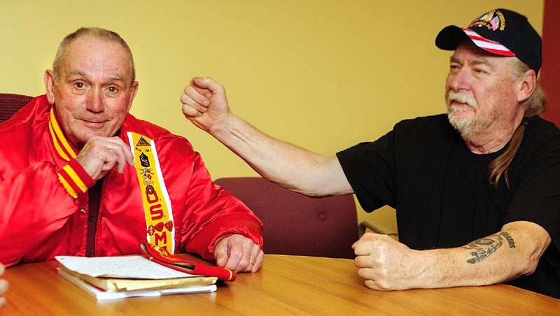 Ralph Sargent, left, smiles as Bill Witt punches his arm while telling the story of how Sargent sent him home after being wounded a third time, while they were in the Marine Corps in battle of Khe Sanh, during an interview on Thursday.
