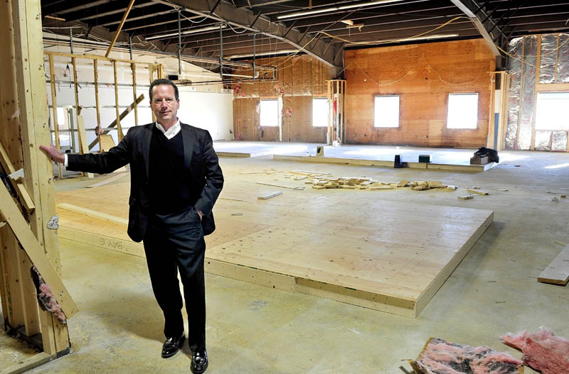 Bill Mitchell stands inside a section of Penney Hill Park on Kennedy Memorial Drive in Waterville, where six retail units will soon be available, on Wednesday. Goodwill Industries of Northern New England occupies another level of the building.