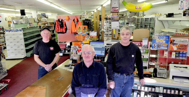 Jerry Keay, left, Daryl Keay and Kevin Keay, all grandsons of Harold Keay, are pictured inside the H.L. Keay & Son store in Albion on Wednesday. The store is closing, probably this week, after 86 years in business.
