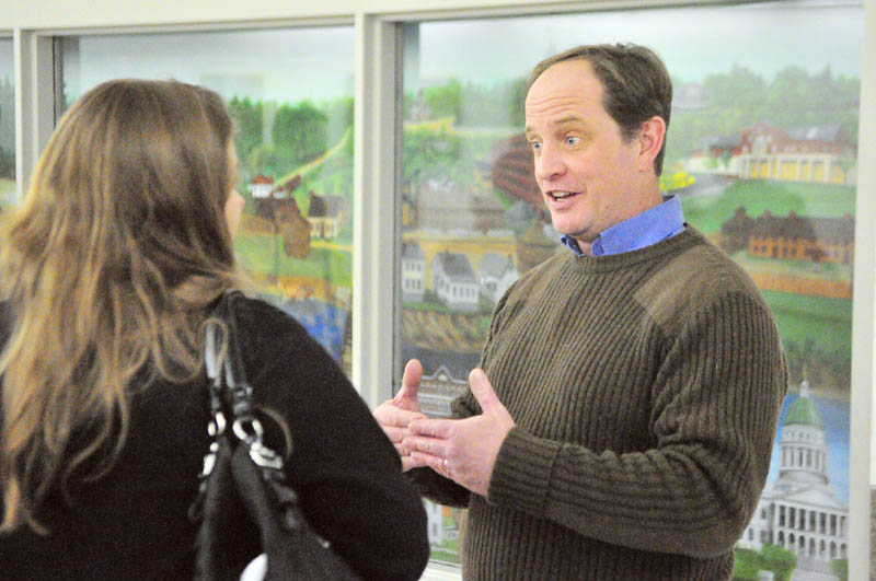 Mark Willis, Republican National Committeeman for Maine, right, chats with Erin Daly, of Portland, on Saturday, after a state committee meeting in Augusta City Center.