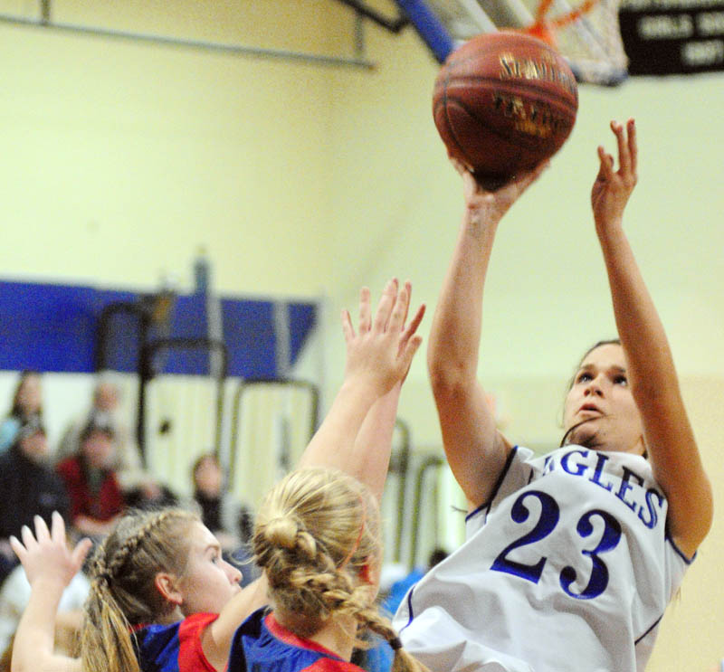 Messalonskee's Taylor Easler, left, and Mikayla Turner try to stop Erskine's Bridget Humphrey during a game on Friday at Erskine Academy.