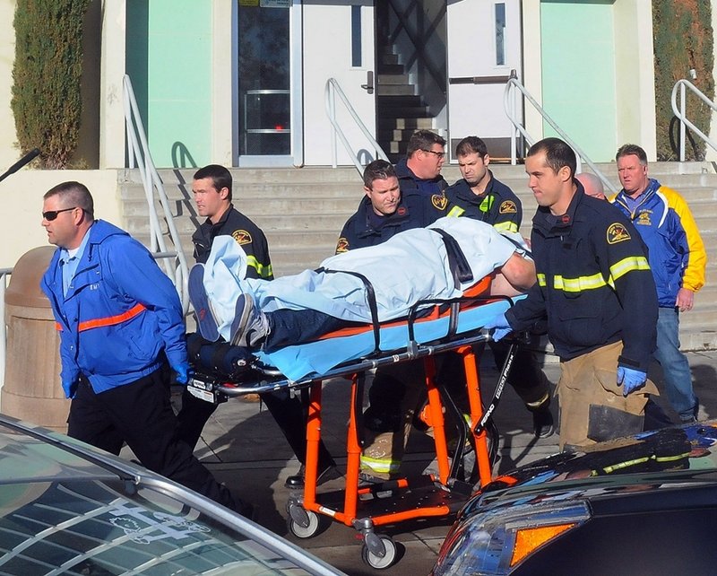 Paramedics transport a student wounded during a shooting Thursday at a high school in Taft, Calif. Police said a student was shot and another student was taken into custody.