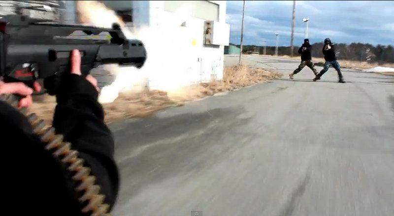 A young actor aims a weapon at two others in this screen image of a scene from “The Extraction,” one of more than two dozen violent videos produced by USN Films of Brunswick.