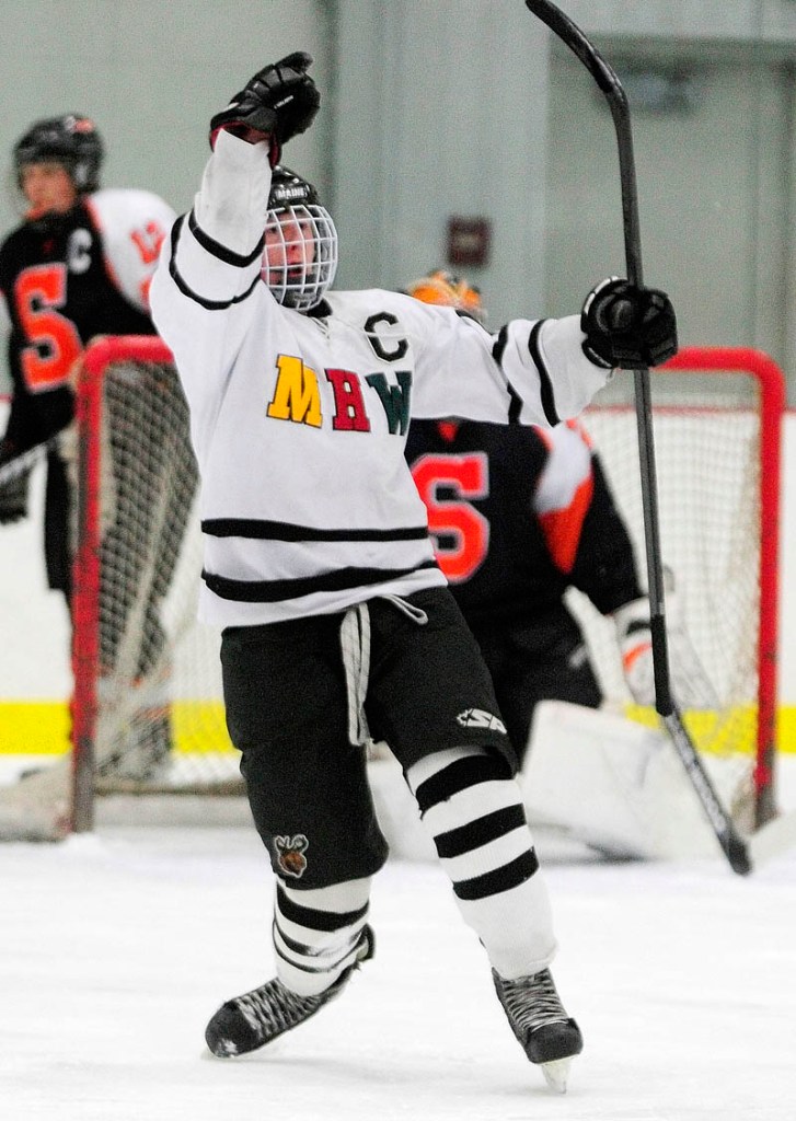 GOAALLLL: MHW junior forward Dan Condon celebrates scoring the Hawks’ first goal during the Hawks’ 4-1 win Saturday in Kents Hill.