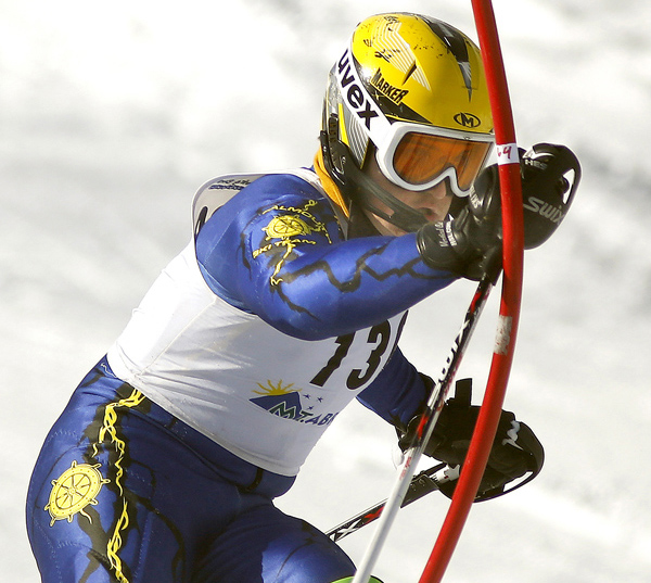 Joseph Lesniak of Falmouth slams down a gate while competing in the slalom race Wednesday at the Class A skiing state championships at Mt. Abram. Lesniak finished fourth, helping the Yachtsmen capture overall and Alpine titles to go with the Nordic championship they won a day earlier.