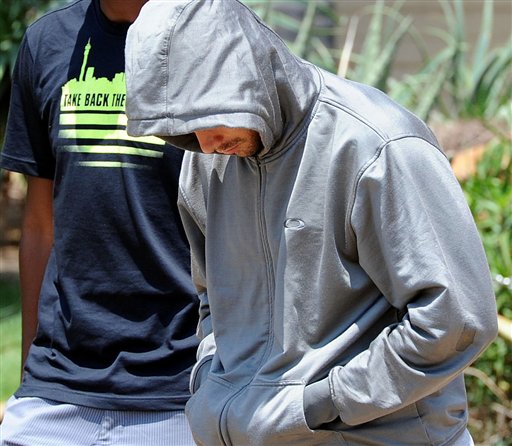 Oscar Pistorius leaves the Boschkop police station, east of Pretoria, South Africa, on Thursday, after questioning by police.