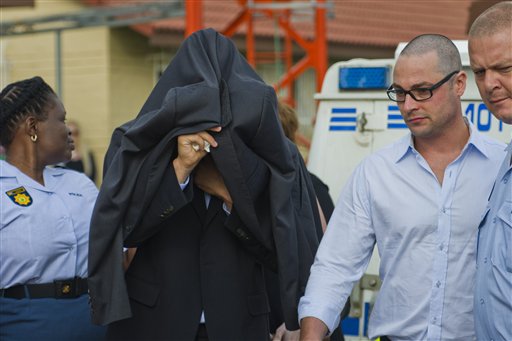 Oscar Pistorius is led from the Boschkop police station east of Pretoria, en route to court on Friday. Pistorius arrived at a courthouse Friday, for his bail hearing in the murder case of his girlfriend as South Africans braced themselves for the latest development in a story that has stunned the country.