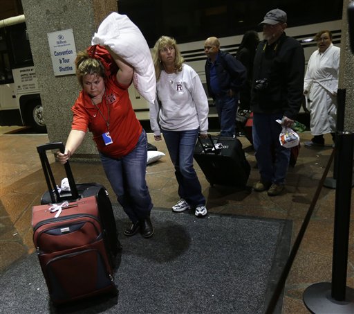 Passengers from the disabled Carnival Triumph cruise ship arrive by bus at the Hilton Riverside Hotel in New Orleans on Friday.