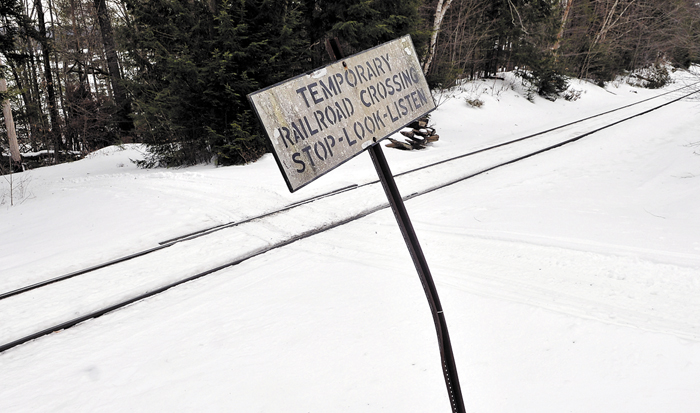 Snow covers the railroad crossing on Dustin Drive in Belgrade Tuesday. PanAm Railways is planning a rate hike for maintenance on private railroad crossings like this one.