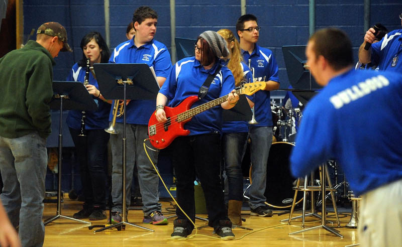 The Lawrence High School pep band performs during warmups before the Lawrence-Skowhegan boys' basketball game in Fairfield Tuesday night.