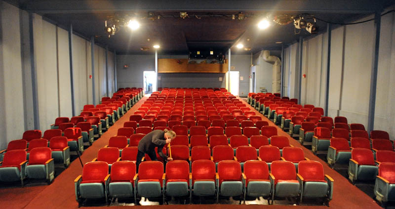 Bill Lashon sweeps the floor of the Pittsfield Community Theatre on Main Street Thursday. Lashon is the projectionist at the theatre, which still plays movies in 35 mm format. The movie industry will be distributing their films in all digital format by the end of the year making the 35mm projection theatres obsolete.