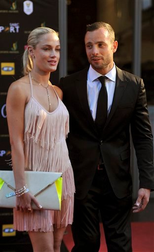 South African Olympic athlete Oscar Pistorius and Reeva Steenkamp, believed to be his girlfriend, attend an awards ceremony, in Johannesburg, South Africa, in this Nov. 4, 2012, photo.