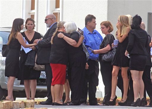 Barry Steenkamp, third left, the father of Reeva Steenkamp, greets people as he and others attend her funeral, in Port Elizabeth, South Africa, on Tuesday.