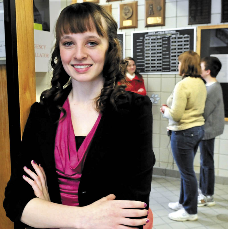 Madison Memorial High School student Lanie Howes, of Athens, who was recognized by Make-A-Wish Maine with the Brendan Batson Award for her success in raising funds to help children with medical needs, is pictured at the school on Thursday. Batson, of Fairfield, was a major fund raiser before he died while riding a bicycle during a Make-A-Wish event. In back is his mother, Yvonne Batson, and brother, Nathanael.