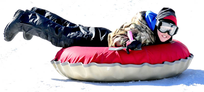 Nicholas Woodside enjoys a day at Eaton Mountain Tubing and Skiing facility in Skowhegan on Monday. Woodside's father, Pat, of North Country Harley Davidson in Augusta, invited a large group to enjoy the first day of school vacation this week.