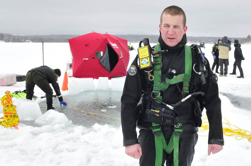Warden diver Tony Gray briefs media on Wednesday on Rangeley Lake.