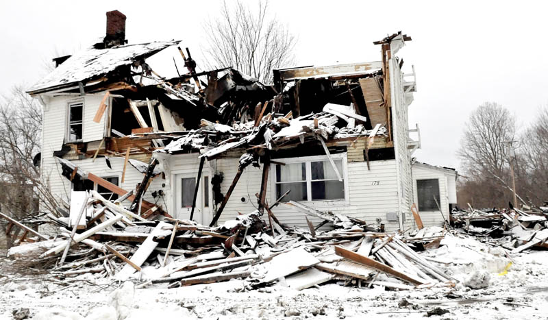 The remains of an apartment building that was destroyed by fire on Saturday, at 178 Main Street in Unity, as seen on Sunday. Four tenants are homeless and firefighters from 14 departments battled the stubborn fire Saturday morning and into the night.