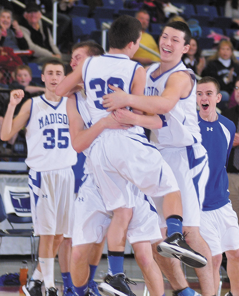JUMP FOR JOY: Madison players celebrate during their 50-48 win over Hall-Dale in a Western C quarterfinal game Monday at the Augusta Civic Center.