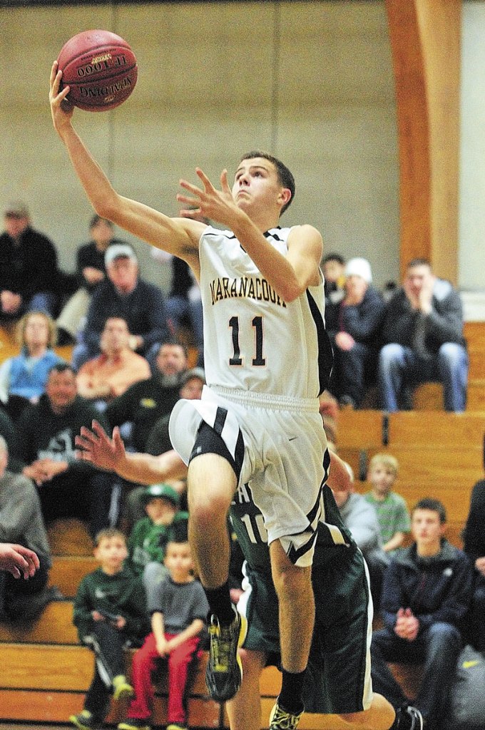 TO THE HOLE: Maranacook’s Taylor Wilbur scored 28 points in the Black Bears preliminary round win over Yarmouth on Tuesday. Maranacook will take on top-seeded Falmouth at 4:30 p.m. today.