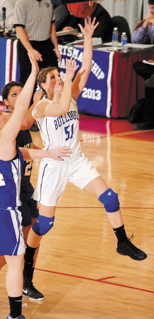 Madison's Kirstin Wood goes up for a shot during a Western Class C quarterfinal against Mt. Abram on Tuesday at the Augusta Civic Center.