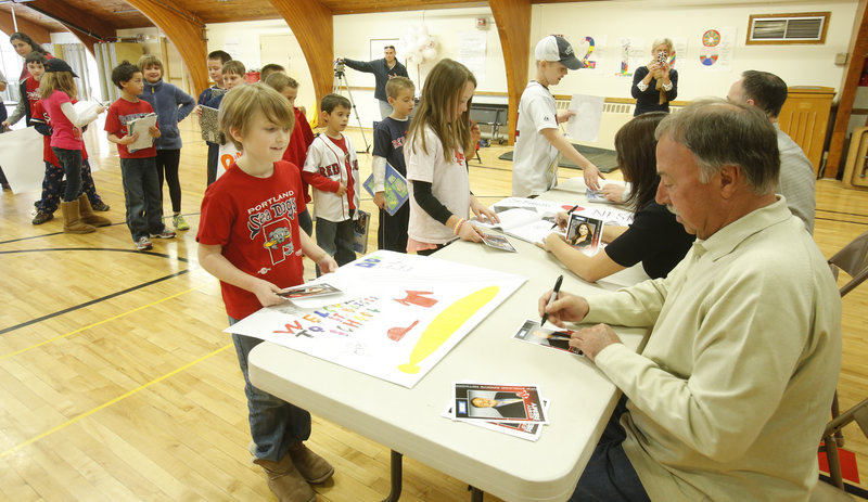 St. Brigid’s School pupils line up for autographs from Jerry Remy, Jenny Dell and Don Orsillo on Thursday when NESN’s team of Red Sox announcers brought their offseason road show to Portland as part of their preseason promotion.