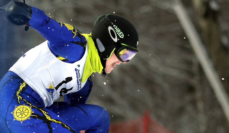 With snow flying around him and a look of determination on his face Wednesday, Cooper Lycan of Falmouth makes his way down Mt. Abram during his final run on the slalom, part of the Class A state title meet.