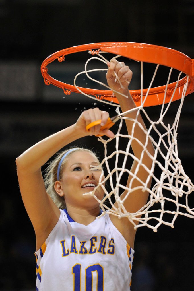 Kari Eldridge snips at the net Saturday after Lake Region downed York 50-24 to win Western Class B.