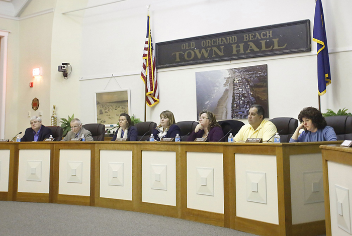Old Orchard Beach Town Councilors, from left, Michael Coleman, Robert Quinn, Linda Mailhot, Sharri MacDonald, Laura Bolduc, Dana Furtado, and Robin Dayton listen to a resident speak during the Old Orchard Beach Town Council Meeting on Feb. 19, 2013.