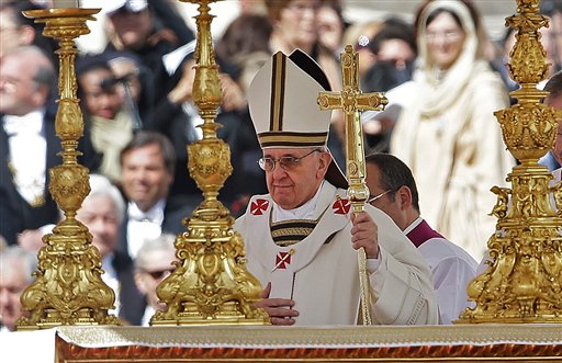 Pope Francis walks past the alter in front of St. Peter's Basilica in St. Peter's Square following his inauguration Mass at the Vatican.