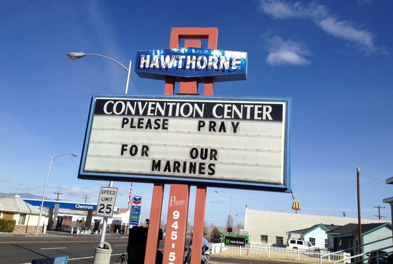 A Convention Center billboard asks people to pray for the Marines that will killed in Hawthorne, Nev. on Tuesday March 19, 2013. Military officials say a mortar shell explosion killed seven Marines and injured a half-dozen more during a training exercise in Nevada's high desert. The accident prompted the Marine Corps to immediately halt use of some mortar shells until an investigation can determine its safety. (AP Photo/The Reno Gazette-Journal, Marilyn Newton)