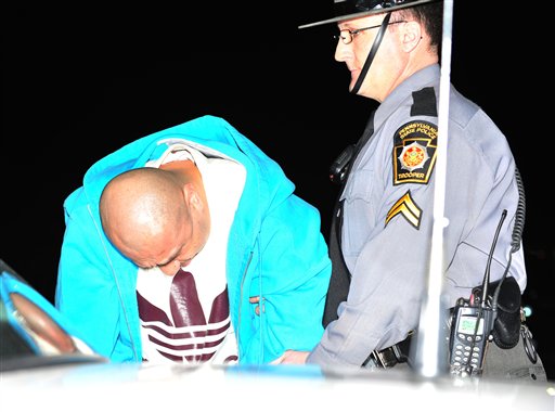 Pennsylvania State Police transport Julio Acevedo, 44, from the State Police Barracks in Bethlehem, Pa, Wednesday night to the Lehigh County Prison.