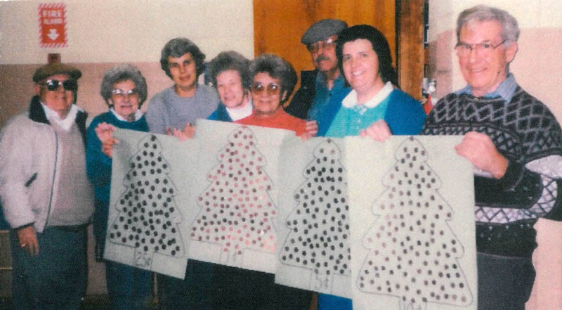 Interfaith Food Pantry volunteers in 1998, including Herbert Scribner, far right, whose son, Mark, contributed $25,000 to the organization in his father's honor. The others in the group, from left, are Bill Nye, Marie Nye, Nancy Marcoux, Marcel Donahue, Juliette Gauthier, Dick Tompkins and Suzie Caverley.