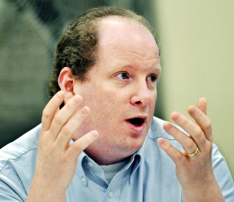 Augusta School Board member Laurence Ringrose discusses the budget Wednesday March 27, 2013 before a vote during a meeting in Augusta.