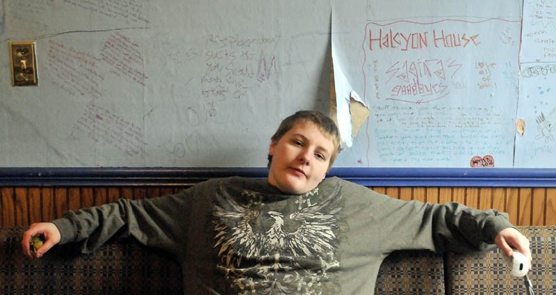 Brian DeMaio, 16, plays video games in the recreation room at the Halcyon House on Middle Road in Skowhegan Friday. The Halcyon House is a homeless shelter for teenagers, operated by Kennebec Behavioral Health.