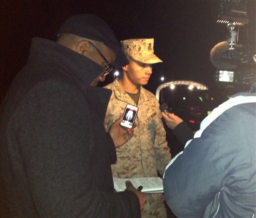 Marine Base Quantico, spokesman Lt. Agustin Solivan briefs reporters following the shootings. Solivan said early Friday authorities believe the suspect was a staff member at the officer candidate school at the base.