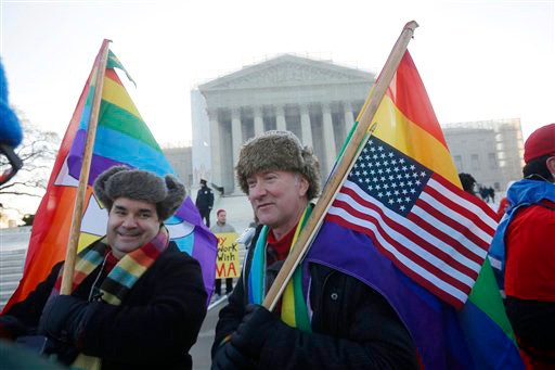 Marcus, left, and Daniel German-Dominguez stand outside the Supreme Court in Washington on Tuesday, before the court's hearing on California's voter-approved ban on same-sex marriage.