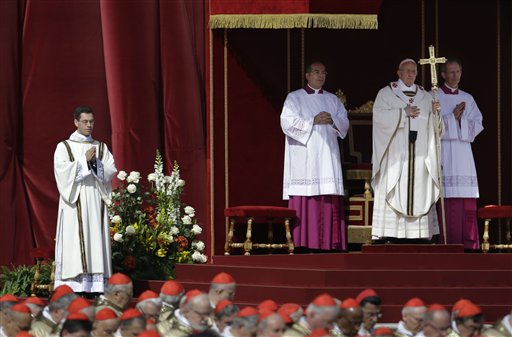Pope Francis stands at the steps of St. Peter's Basilica during his inaugural Mass in St. Peter's Square at the Vatican on Tuesday.