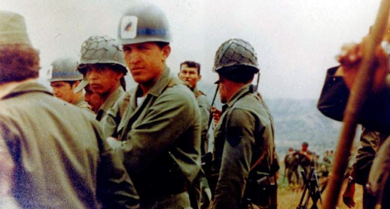 In this undated photo released by Miraflores Press Office, Hugo Chavez, center, looks at the camera during a military exercise in Venezuela. Venezuela's Vice President Nicolas Maduro announced on Tuesday, March 5, 2013 that Chavez has died. Chavez, 58, was first diagnosed with cancer in June 2011. (AP Photo/Miraflores Press Office)