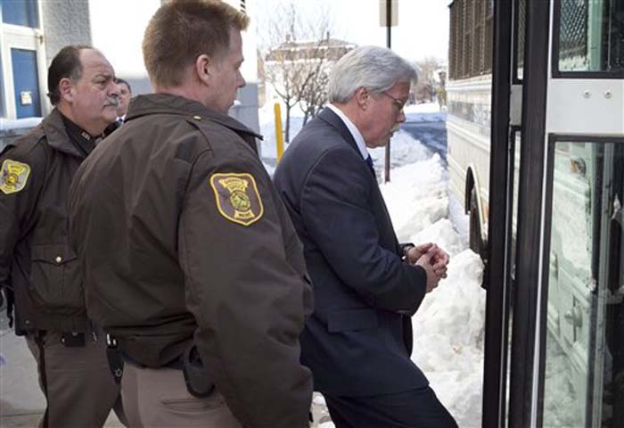 Mark Strong Sr. leaves the Cumberland County Courthouse and is taken to jail after receiving a 20-day sentence and a $3,000 fine for his role in the Zumba prostitution case.