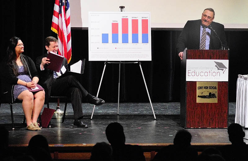 Staff photo by Joe Phelan Michelle Zhang, Cony senior, Stephen Bowen, Maine commissioner of education, listen as Gov. Paul LePage opens the Governor�s Conference on Education: Putting Students First on Friday March 22, 2013 at Cony High School in Augusta.