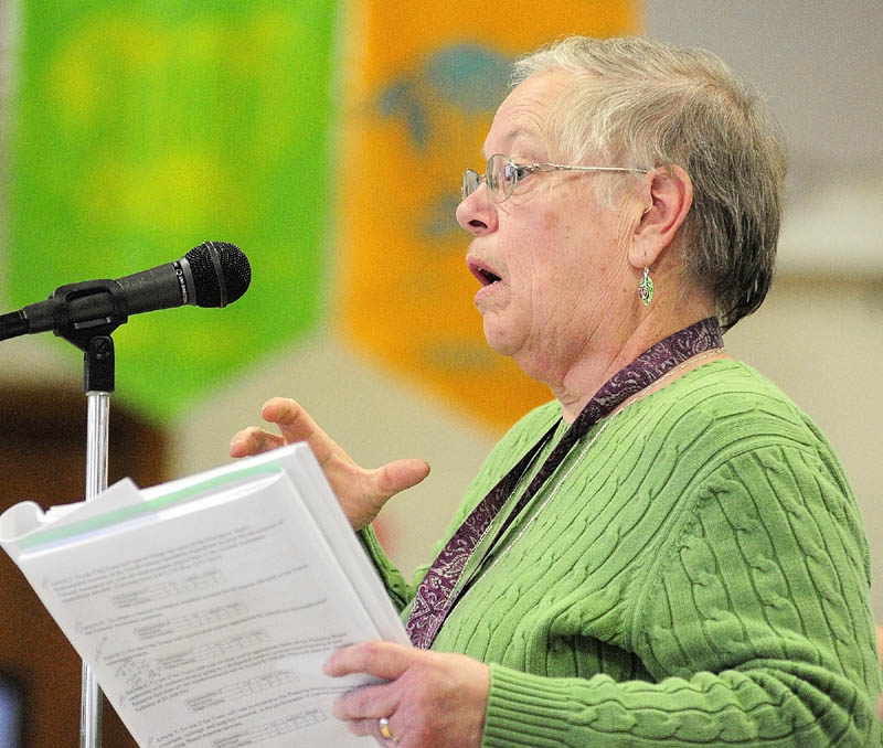 Jane Hubert participates in the debate during the Pittston Town Meeting on Saturday, March 16, in the Pittston School gym.