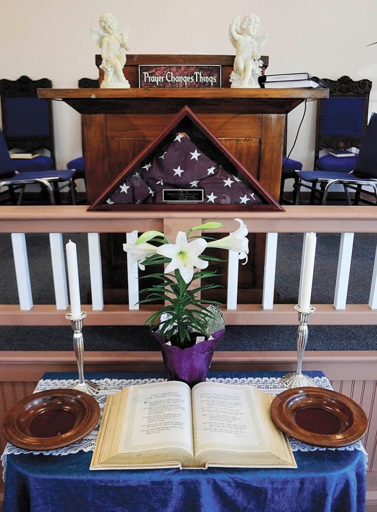 An open Bible is on the table on Saturday at the new location for the Augusta Spiritualist Church, on Townsend Road behind Barnes & Noble Booksellers.