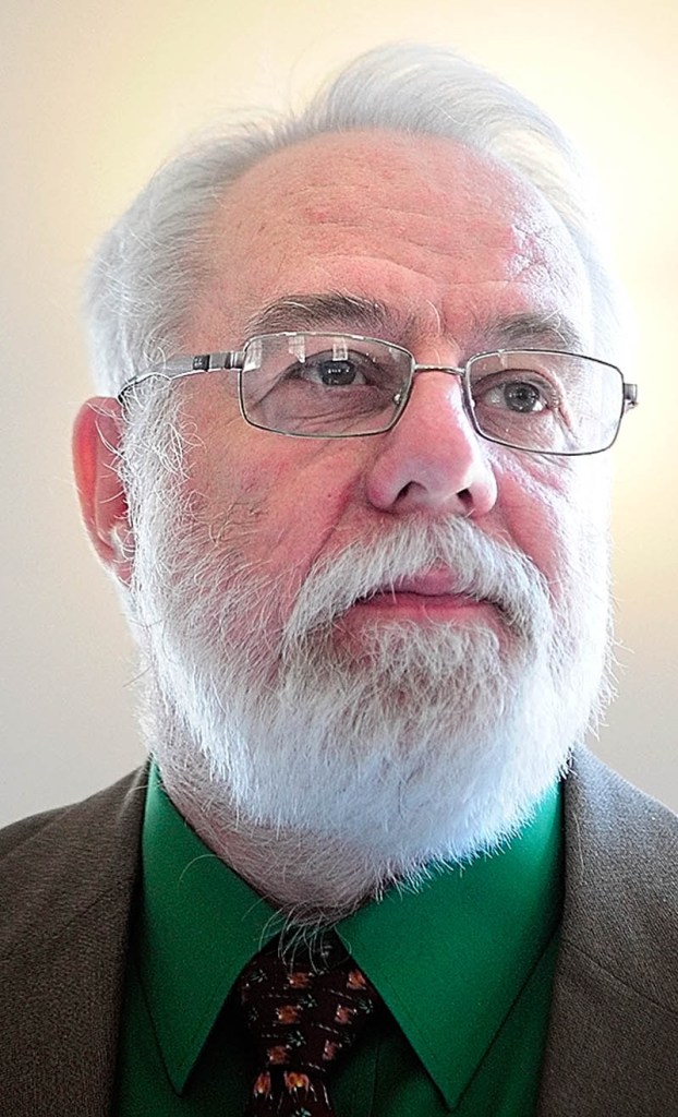 The Rev. Graham Connolly, president of the Maine State Spiritualist Association, answers questions on Saturday at the new location of the Augusta Spiritualist Church, on Townsend Road behind Barnes & Noble Booksellers.