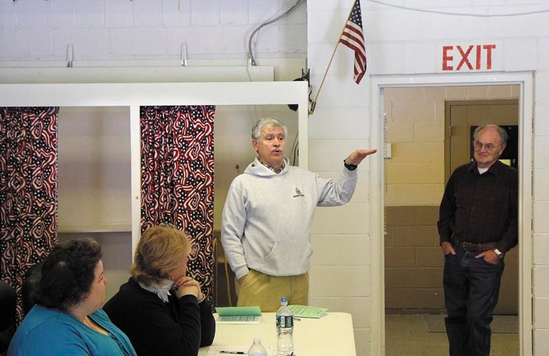 State Sen. Tom Saviello, R-Wilton, addresses residents before the start of the Rome Town Meeting on Saturday. Saviello, who represents District 18, addressed current issues and took questions from residents while waiting for a quorum to arrive.
