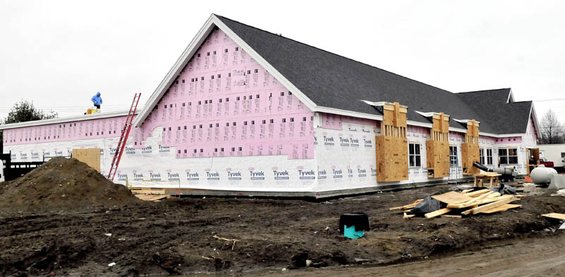 Workers continue to make progress building the new Waterville police department building on Tuesday. The building is expected to be completed this June.