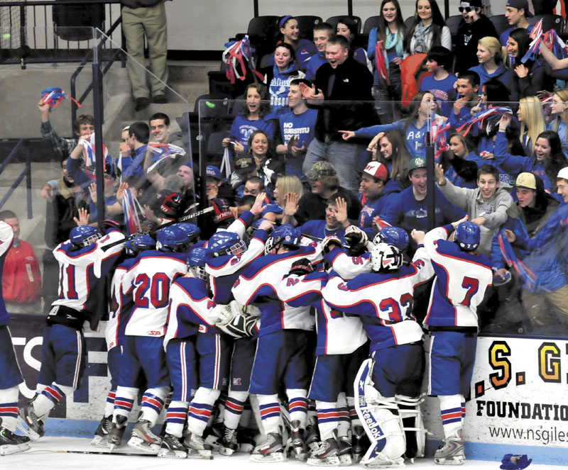 Messalonskee fans and players celebrate after the Eagles beat John Bapst 7-2 in the Eastern B regional final Tuesday at Alfond Arena.