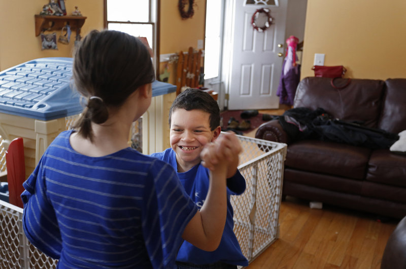 Shavar dances with his sister.